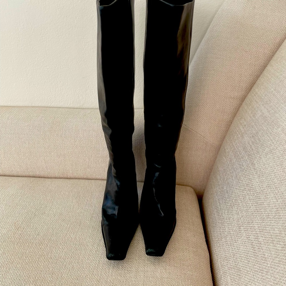 Prada boots Black leather.  Size 38. Excellent preowned condition.